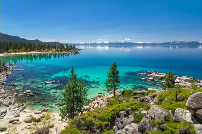activities at lake tahoe in summer - gorgeous view from above sand harbor - blue water with mountains in the distance